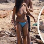 Las tetas de Lorena Castell al descubierto pillada haciendo topless en la playita